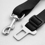 Close up of adjustable buckle and metal clip on dog safety belt