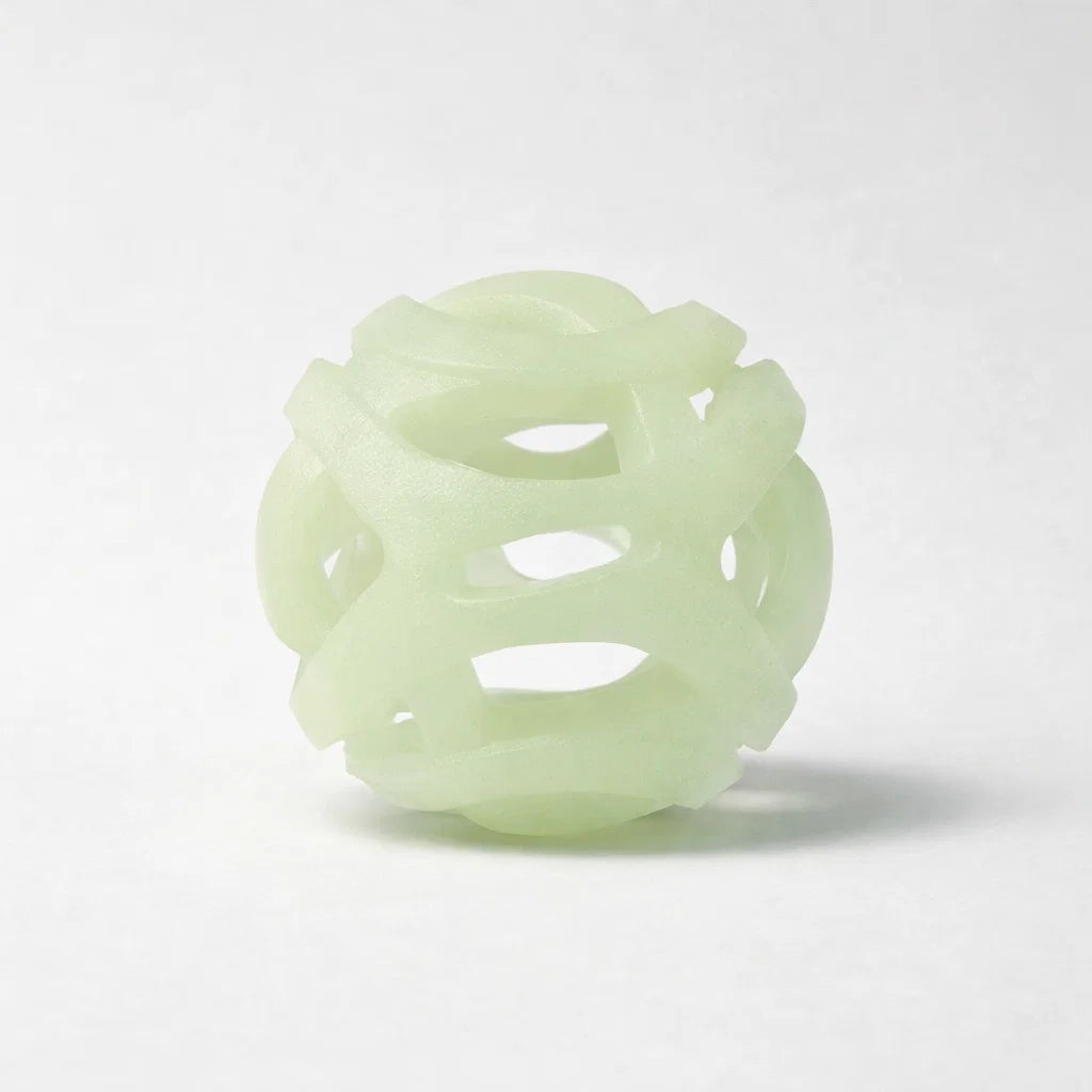 Glow in the dark breathable fetch ball on a clean studio background