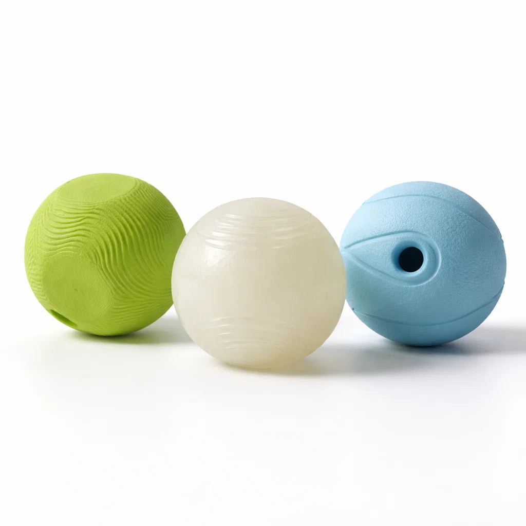 Three Chuckit fetch balls from the Fetch Medley S set on a white background