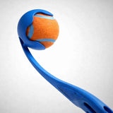 Close-up of a blue ball launcher cup holding an orange tennis ball