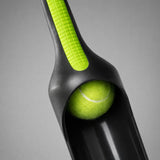 Close-up of dog ball launcher cup holding a tennis ball
