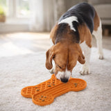 Dog licking food from AFP Bone Appetit lick mat during slow feeding