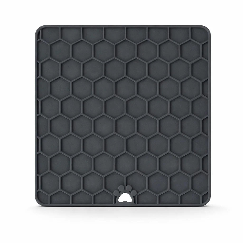 Grey silicone fun and relax lick mat on white background