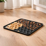 Grey fun and relax lick mat filled with soft dog food
