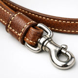 Brown leather show leash stitching and metal clip detail